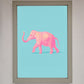 Pink Elephant on Blue Framed Print